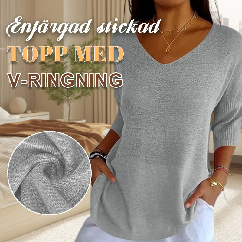 Enfärgad stickad tröja med V-ringning